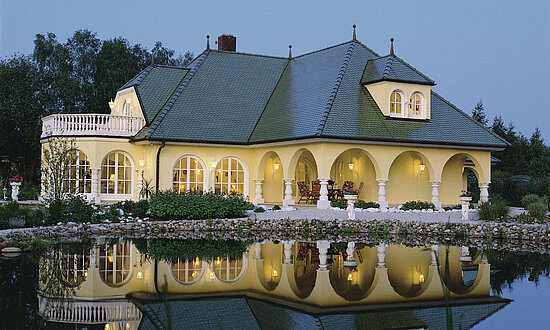Luxury timber frame house with round arches